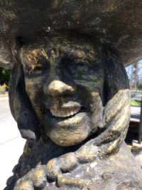 Statue with false teeth