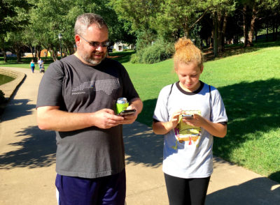 Father and daughter play the game in the park